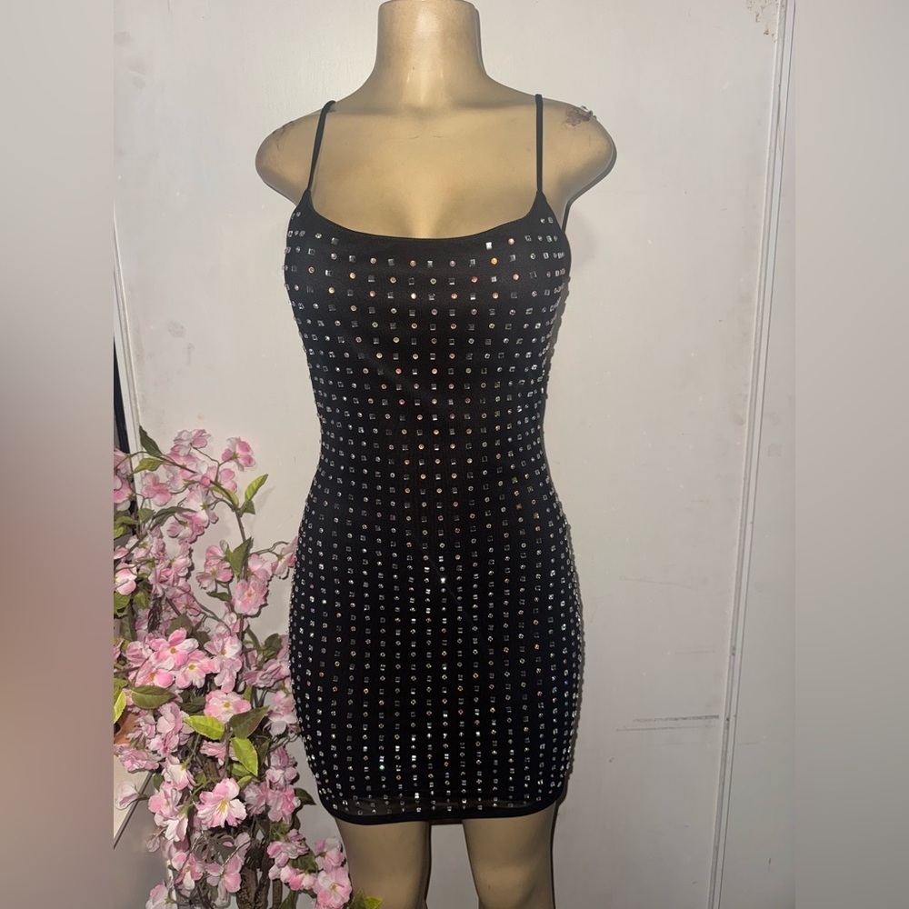 B. Smart Black Mini Dress with Metallic Accents